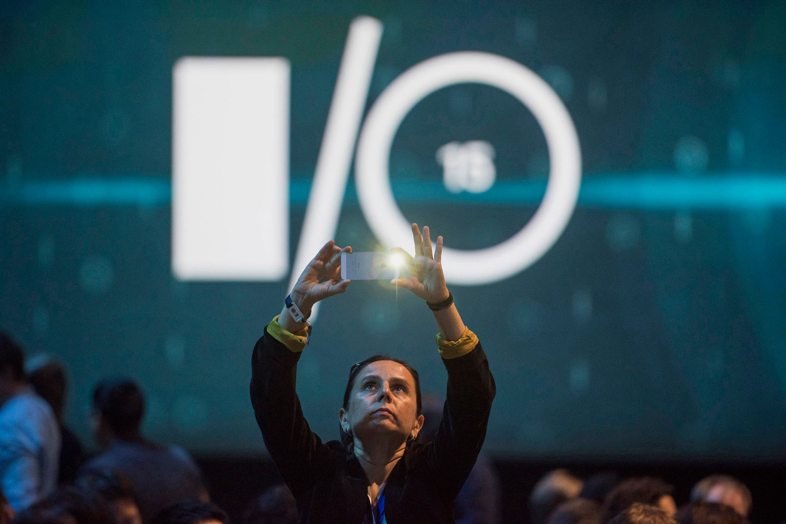 An attendee takes a photograph before the start of the Google I/O annual developers conference in San Francisco