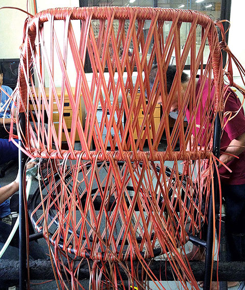 An Ahnda chair under construction at Dedon's factory in the Philippines, which employs 1,600 weavers who make 300 pieces a day by hand.