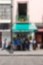 Customers surround Taqueria Los Cocuyos during lunch hour.