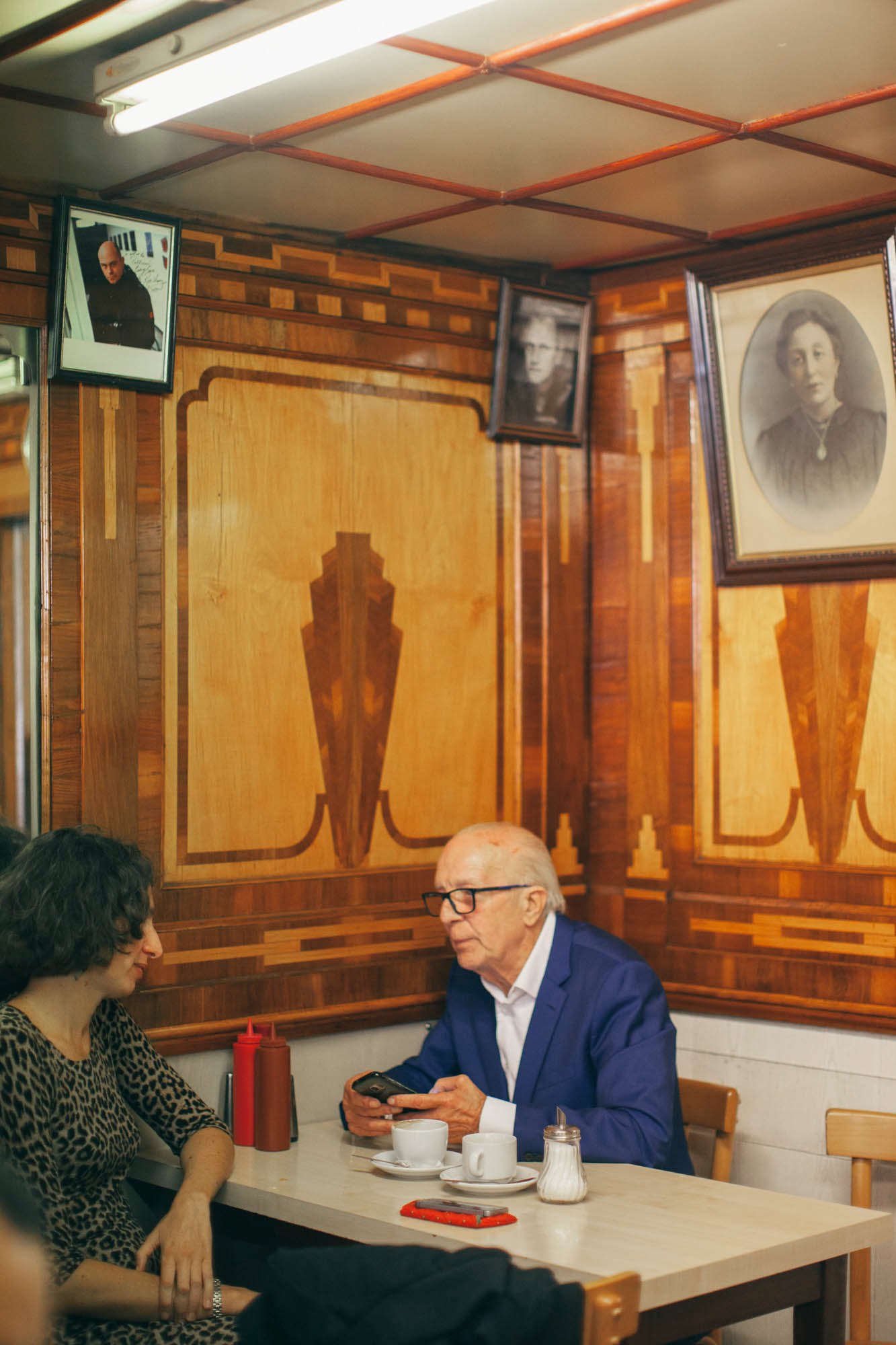 Portraits line the wall of the time-honored spot.