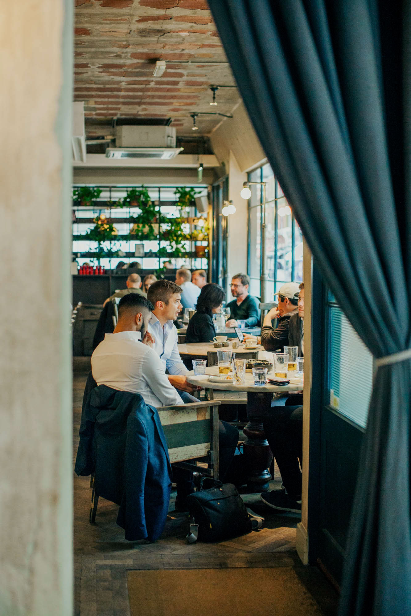 The light-filled cafe brings in crowds throughout the day.