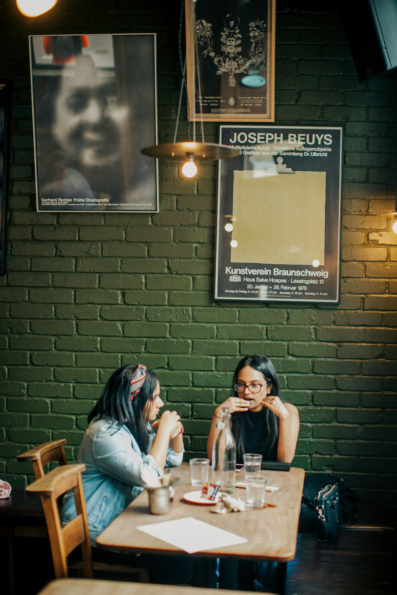 Moss-green walls are decorated with art posters at Shoreditch’s Thai hotspot.