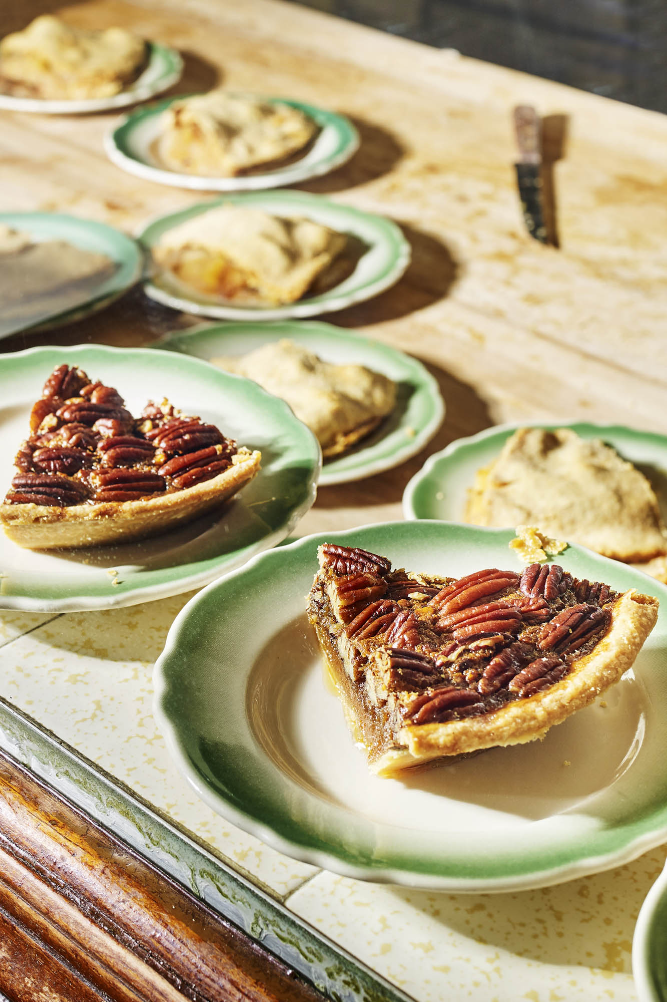 Slices of classic pecan and apple pies for dessert