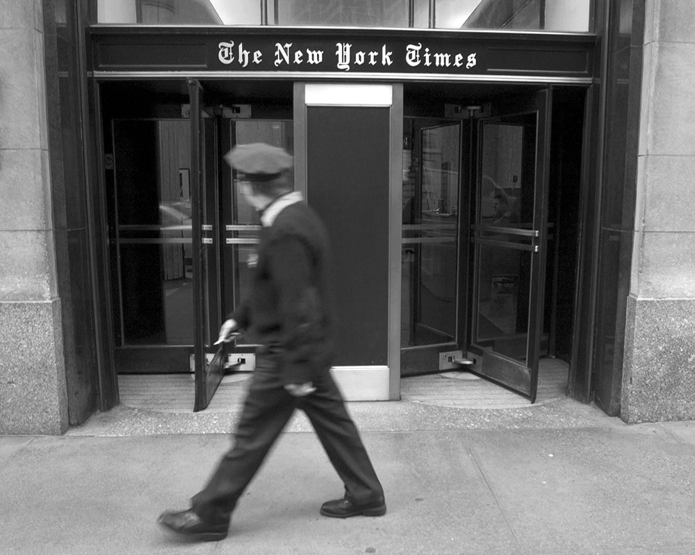 A security guard walks outside the