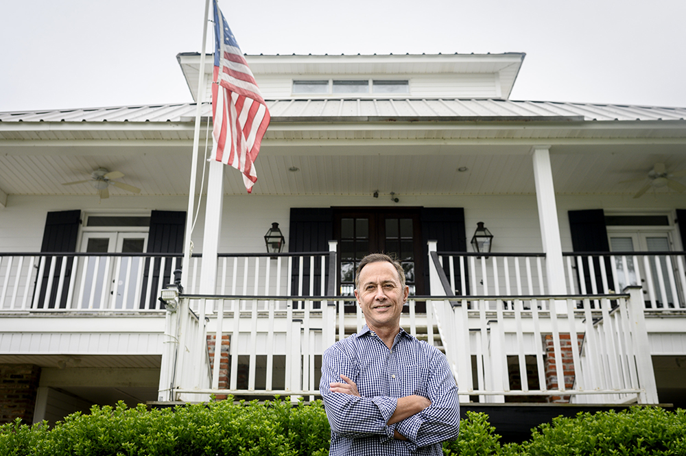 Gerard Braud poses for a portrait outside his home. 