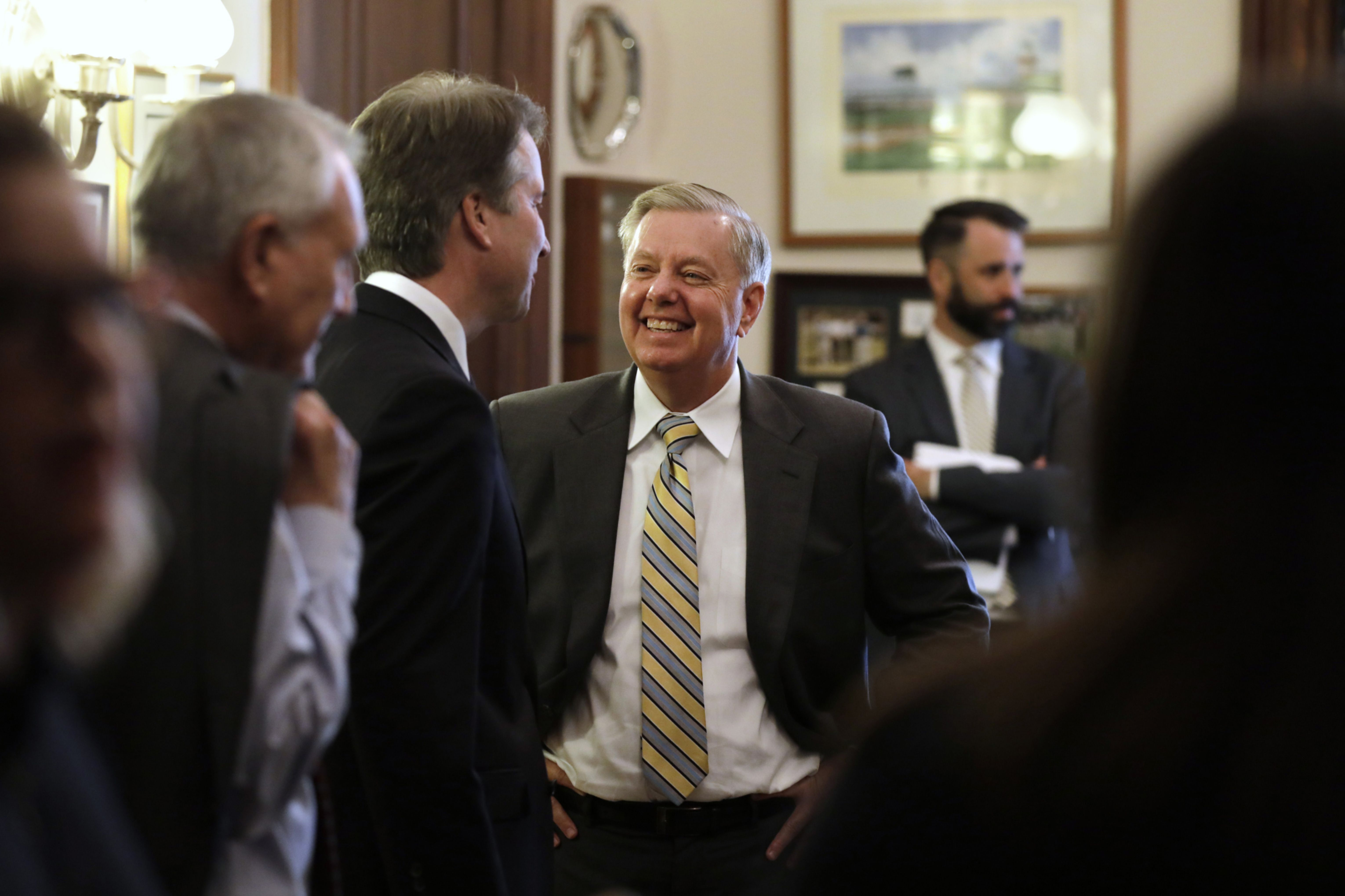 Sen. Lindsey Graham speaks with U.S. Supreme Court nominee Brett Kavanaugh during a meeting on Capitol Hill in Washington, D.C., on Wednesday, July 11, 2018.